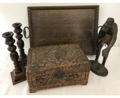 A collection of wooden items. To include oriental carved box, Pair of candle sticks and vintage 2 handled tray. 