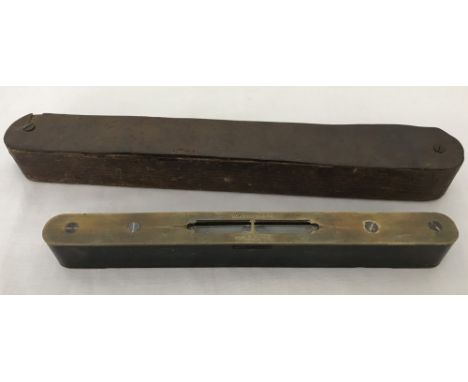 A small vintage wooden and brass spirit level. Complete with outer wooden case. 