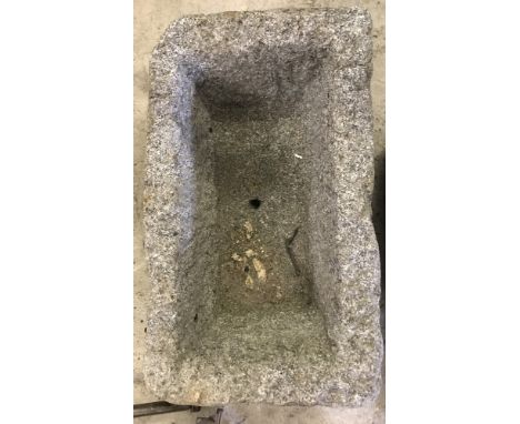 A heavy granite trough/planter.  Approx. 40cm x 24cm x 19.5cm tall.