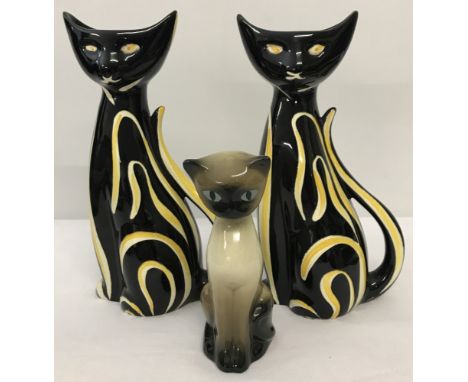 2 retro black and yellow ceramic cat vases together with a Siamese cat figure.  
