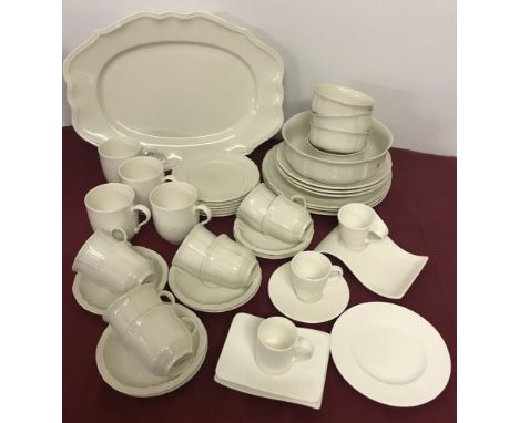 A large quantity of cream coloured Villeroy & Boch ceramics. To include dinner plates, coffee cups & saucers, bowls, mugs, se