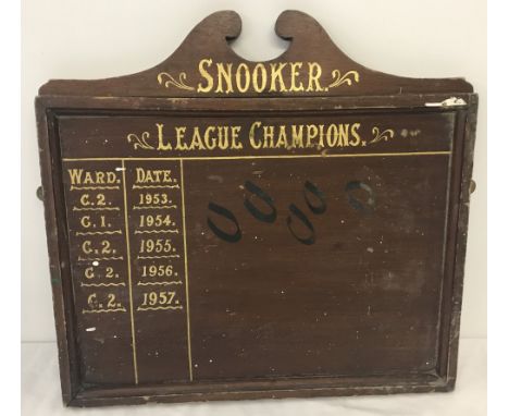 A vintage wooden Snooker score board.  