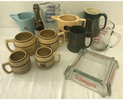 A collection of vintage breweriana. To include glass and ceramic advertising water jugs, tankards and ashtray. 
