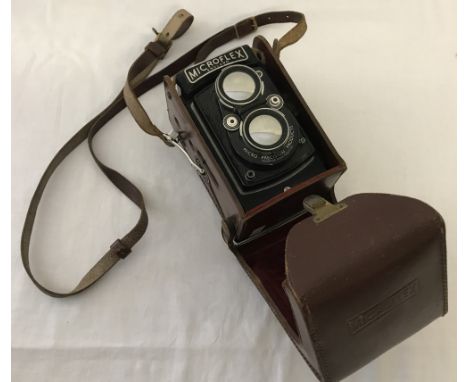 A vintage Microflex 2 lens reflex camera in leather case.  