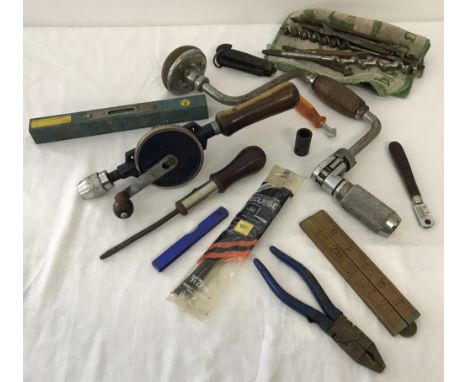 A box of vintage hand tools. To include hand drills, glass cutter and penknife. 