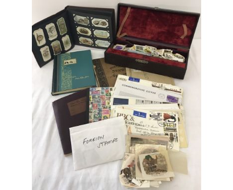 A collection of vintage stamps albums, cigarette album and stamps . To include British and world stamps. 