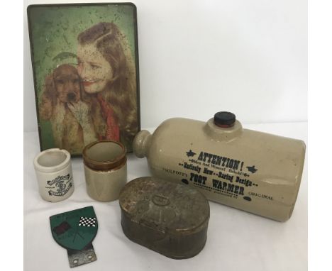 A box of mixed items. To include a stone bed warmer, vintage Mallory Park Motor Club card badge Sainsbury's potted meat jar a