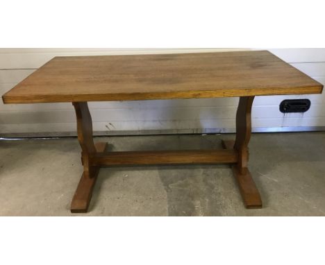 A vintage light wood refectory style dining table.  Approx. 153cm wide x 77.5cm tall.
