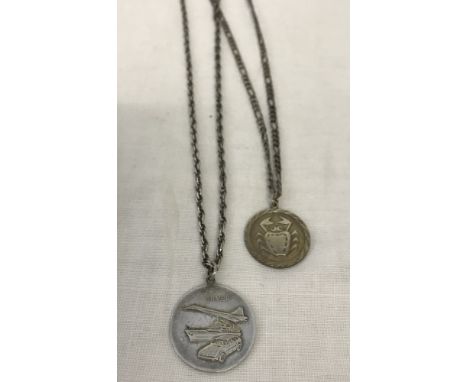 A silver St Christopher pendant on a 22inch silver rope chain. Together with a silver Cancer zodiac pendant on a 18inch figar