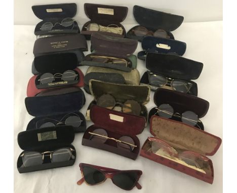 A collection of cased vintage spectacles to include horn rimmed, wire rimmed and sunglasses. Examples from East Anglian Optic