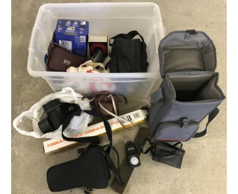A box of vintage photographic equipment. To include Kodak, Hanimex & Halina cameras, Cobra monopod and other accessories 