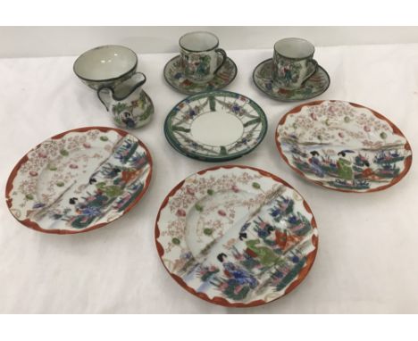 A small collection of oriental tea wear. Comprising 2 coffee cans and saucers, cream jug and sugar bowl and two matching  cak