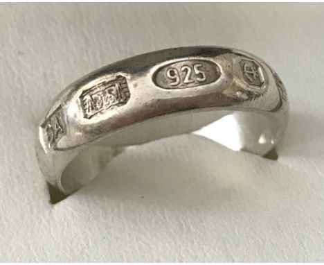 A 925 silver band ring with hallmarked decoration.  Size U.Total weight 5.8g.