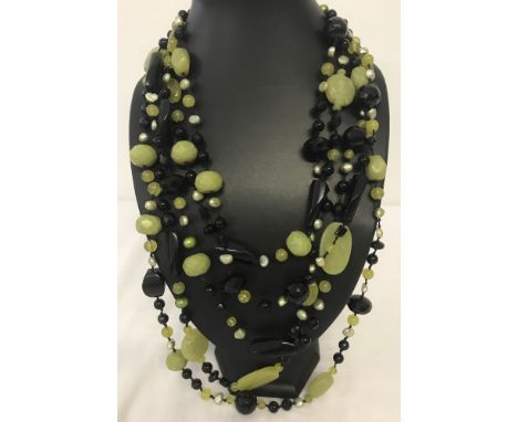 A 5 strand natural jade, black spinel and green potato pearl statement necklace.  