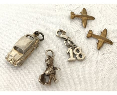 A 925 silver "18" charm with lobster claw clasp. Together with a white metal VW Beetle charm and a jointed teddy bear charm a