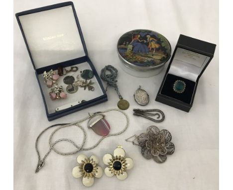 A small quantity of costume, silver and white metal jewellery. To include a silver cocktail ring set with a green stone and m