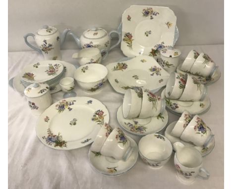 A large quantity of mid 20th century Shelley "Wild Flowers" tea and coffee ware. Comprising; Teapot, milk jug, sugar bowl, 6 