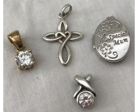 4 small silver pendants. An oval Special Mum locket, 2 clear stone set pendants and a cross with central heart decoration. 