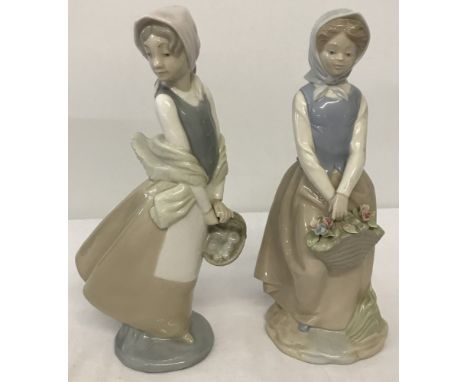 2 Spanish ceramic figurines of girls. Nao figurine of girl with fruit basket Together with one other. 