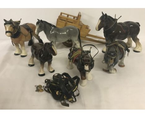 A quantity of ceramic Shire horses. To include Melba Ware and handmade wooden cart. 