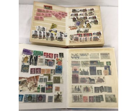 A vintage red Lighthouse stamp album containing British an world stamps. Together with a vintage blue stamps album containing