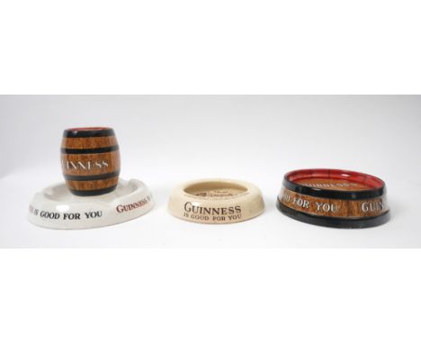 Guinness ashtrays A ceramic promotional Guinness matchbox holder / ashtray, by Mintons; together with a barrel-top shaped ash