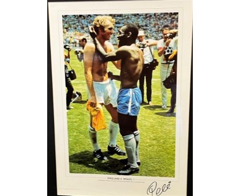 FOOTBALL - PELE [EDSON ARANTES DO NASCIMENTO] (BRAZILIAN, 1940-2022), FOOTBALLER  A colour photographic print of Pele and Bob