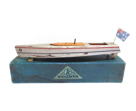A KELLNER SPEED-BOAT,  the hull painted silver with red and blue lining, fitted with a clockwork motor (untested), 45cm long,