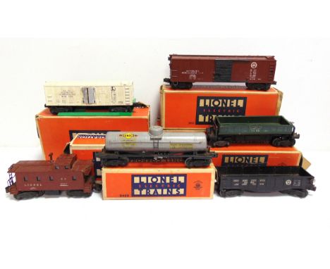 [O GAUGE]. A LIONEL ROLLING STOCK, TRACK &amp; LINESIDE ACCESSORY COLLECTION  comprising a No.3462, Operating Milk Car; No.28