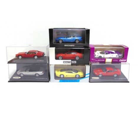 SEVEN 1/43 SCALE DIECAST MODEL CARS  comprising a Minichamps No.400 130530, Jaguar XK Convertible, metallic light blue; Minic