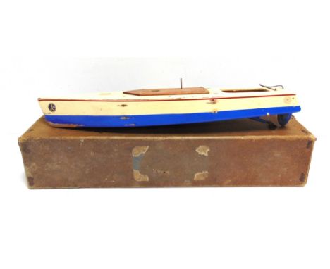 A KELLNER SPEED-BOAT,  the hull painted cream over blue, fitted with a clockwork motor (untested), 45cm long, boxed. Conditio