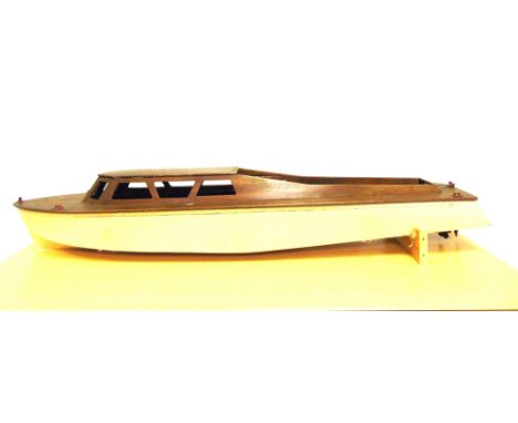 A BASSETT-LOWKE LIVE STEAM FAST MOTOR BOAT, 'STREAMLINIA'  circa 1938, with a varnished wood cabin, plank effect decking, and