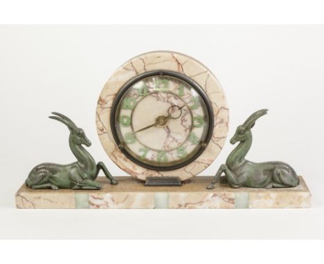 AN ART DECO MARBLE & GREEN ONYX FACED POLISHED AGGREGATE MANTEL CLOCK, the circular dial with green patinated Arabic numerals