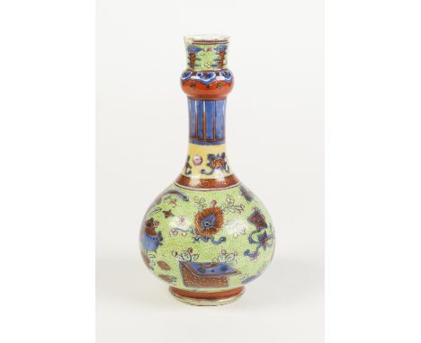 A CHINESE PORCELAIN BOTTLE SHAPE VASE, painted in underglaze blue with possibly 'clobbered' overglaze enamelling, with Buddhi