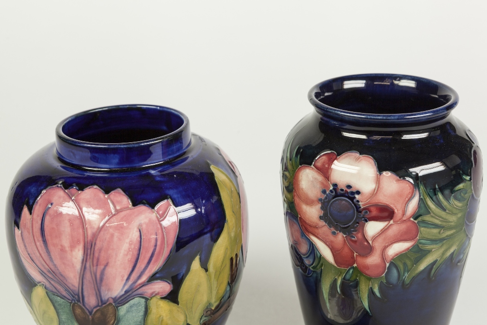 TWO PIECES OF WALTER MOORCROFT TUBE LINED POTTERY ON BLUE GROUNDS