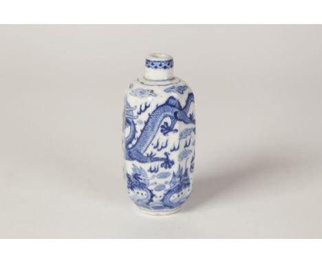 A CHINESE PORCELAIN OCTAGONAL SNUFF BOTTLE (minus stopper), finely painted in underglaze blue with two sinuous scaly five cla