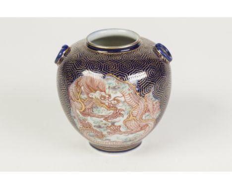 A SMALL JAPANESE MEIJI PERIOD SHOULDERED OVOID VASE, with applied faux ring handles, the blue ground gilt vermiculated and re