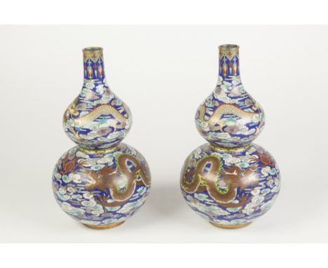 A PAIR OF GOOD QUALITY LATE QING DYNASTY CLOISONNE DOUBLE GOURD SHAPE VASES, each worked to the broader body with two sinuous