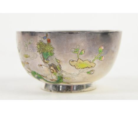 A white metal and enamel bowl; the base with Beijing and Sterling Silver marks, 9.5 cm diameter; decorated with a bird perche