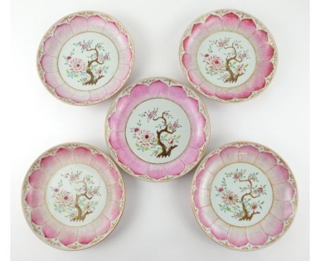 A set of five famille rose dishes; each one decorated with a central floral design surrounded by a leaf-shaped design; some g