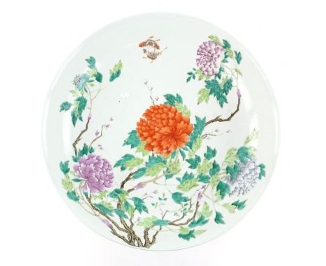 A large and decorative dish of cylindrical form, decorated with butterflies and bold floral designs; the base with Qianlong s