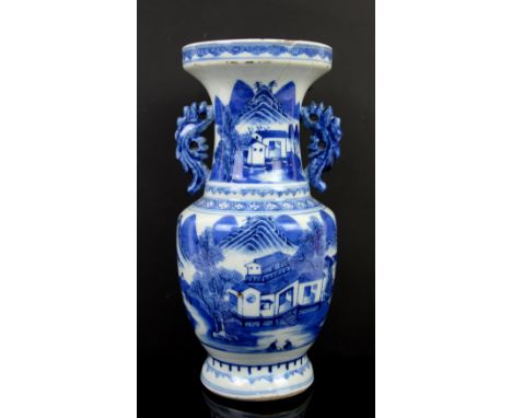 A small blue and white vase and cover with knop finial, decorated with fan-tailed goldfish; the base with Kangxi four-charact