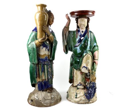 Two Associated green and blue glazed ceramic figures, possibly South Chinese, comprising: One holding a large vase with both 