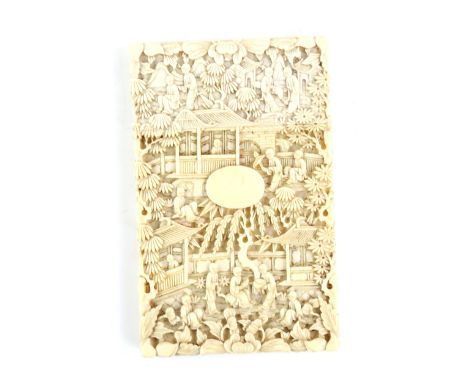 A Cantonese ivory card case and cover, carved with typical designs of scholars beside pagoda buildings and gardens; 10.5 x 6.