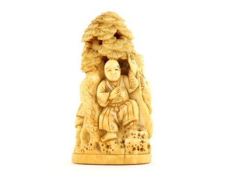 Early 20th century Japanese carved ivory group of four figures beneath a pine tree, signed to base, 8.5cm high,PLEASE NOTE: T