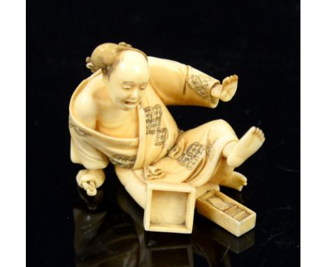 Early 20th century Japanese ivory figure of a seated man with a rat on his head, signed, 5cm high,PLEASE NOTE: THIS ITEM CONT