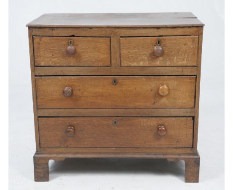 An 18th Century oak chest of drawers
The rectangular plank top with a moulded border above a plain frieze with two short and 