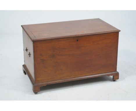 An early 19th Century Anglo Indian teak travel chest
The rectangular hinged top with a rosewood border inlaid with an oval en