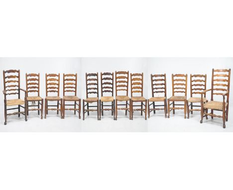 A Harlequin matched set of twelve Ash and Elm ladder back dining chairs
With turned finials the side chairs with cylindrical 