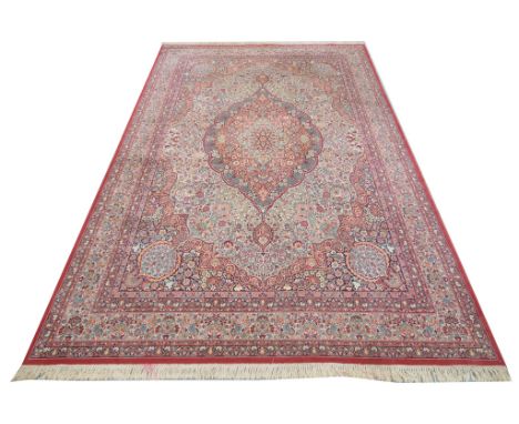 A modern Keshan 'carpet' with guard strip
With a central medallion enclosing flowers and leaves leaf and flower spandrels fri